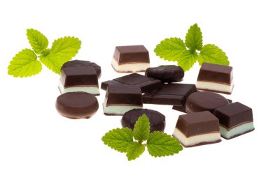 Chocolate candies with mint on white background clipart