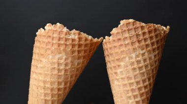 ice cream in a waffle cone on a black background