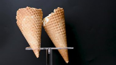 ice cream in a waffle cone on a black background
