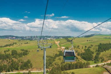 Cable car to Tornik mountain from Zlatibor. Beautiful summer landscape from above. clipart