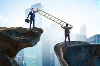 İş adamları uçurumun üstesinden gelmeye yardım ediyor.