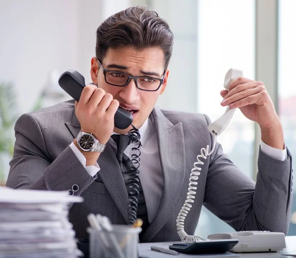 stock image The helpdesk operator talking on phone in office