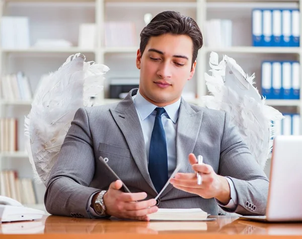 The angel investor concept with businessman and wings