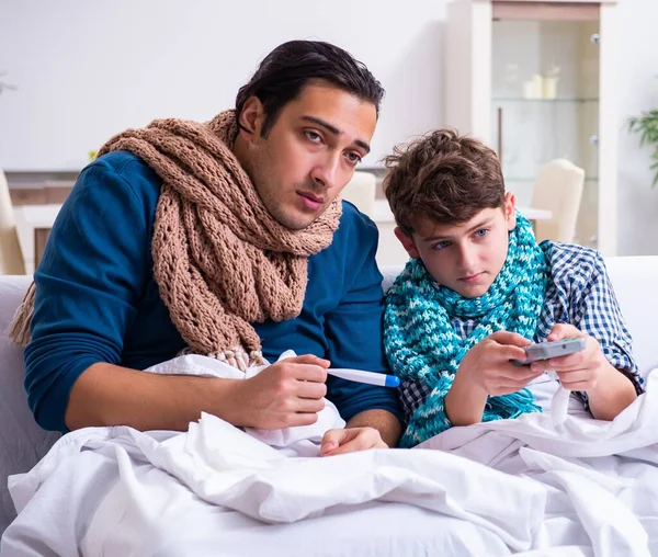 Young Father Caring Sick Son — Stock Photo, Image
