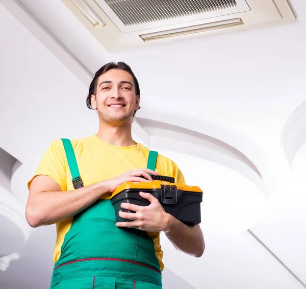 Young Repairman Repairing Ceiling Air Conditioning Unit — Stock Photo, Image