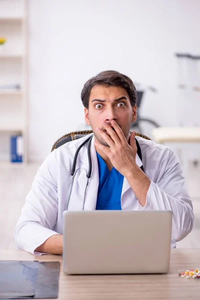 stock image Young doctor in telemedicine concept