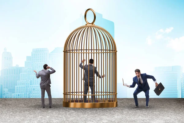 Business people and the golden cage concept