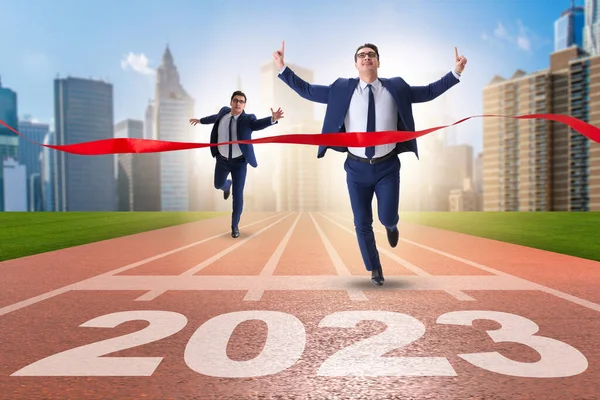 Businessman running to the new 2023 year
