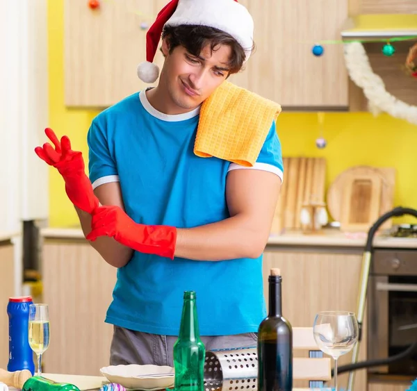 Young Man Cleaning Kitchen Christmas Party — Stock Photo, Image