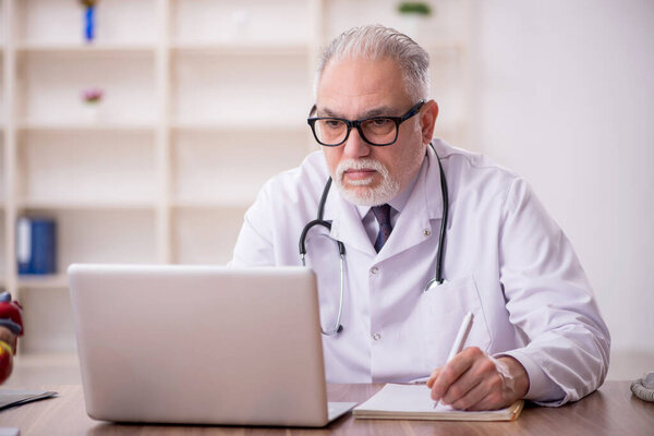 Old doctor in telemedicine concept