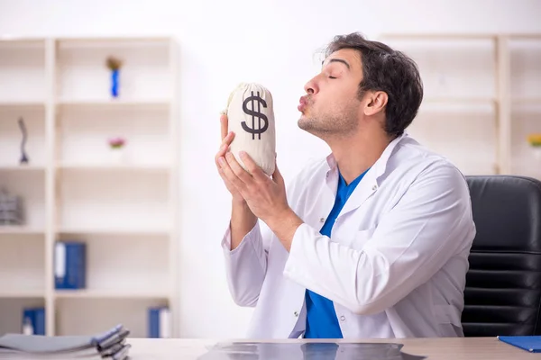 Young Doctor Holding Moneybag Hospital — Stock Photo, Image