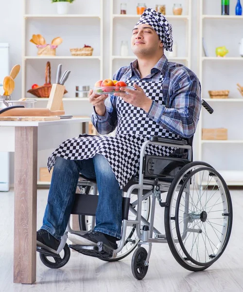 The young disabled husband preparing food salad