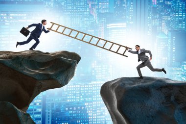 İş adamları uçurumun üstesinden gelmeye yardım ediyor.