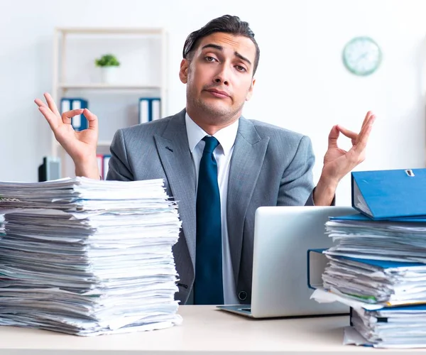 The businessman with heavy paperwork workload