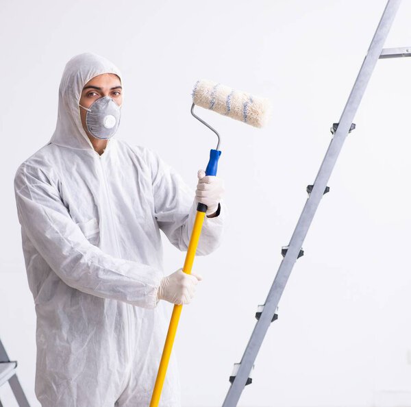 Painter working at the construction site