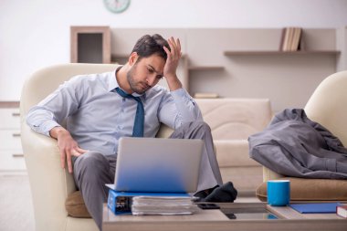 Young employee working from home during pandemic