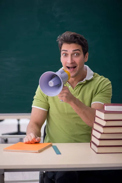 Young Male Student Holding Megaphone Classroom — Stockfoto