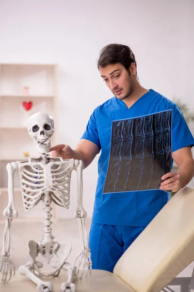 Young doctor and skeleton patient at the hospital