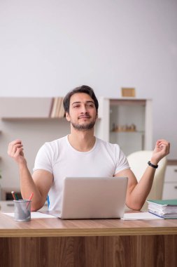 Young employee working from home during pandemic