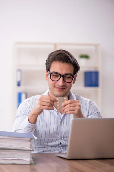 Young Male Employee Holding Pills Office — Stockfoto