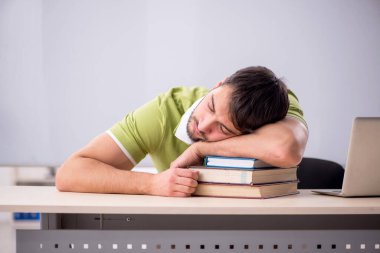 Young teacher student in the classroom