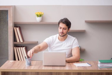 Young employee working from home during pandemic