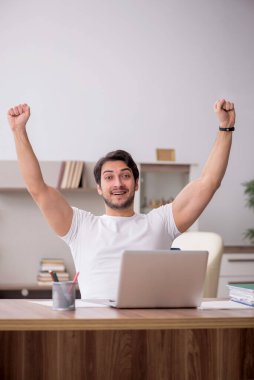 Young employee working from home during pandemic