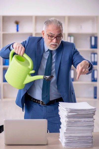 Old Businessman Employee Watering Papers Can —  Fotos de Stock