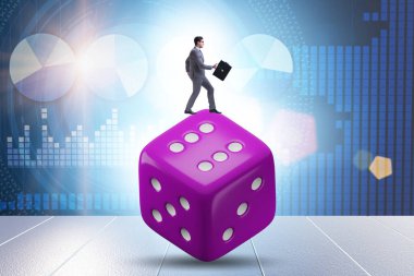 Businessman in uncertainty concept with the dice