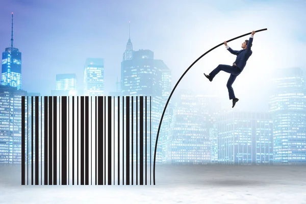 Businessman jumping over bar code in the pole vaulting