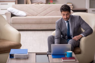 Young employee working from home during pandemic