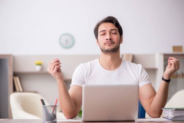 Young employee working from home during pandemic