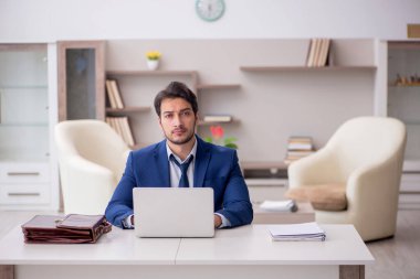 Young employee working from home during pandemic