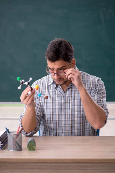 Young Teacher Holding Molecular Model — Photo