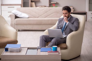 Young employee working from home during pandemic