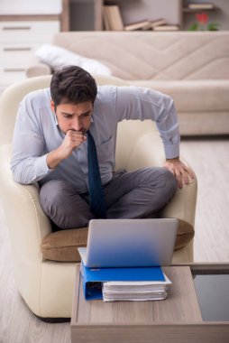 Young employee working from home during pandemic