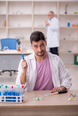 Two chemists working at the lab