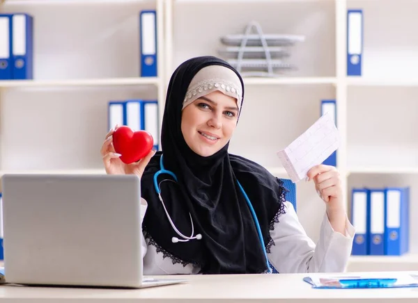 The young doctor in hijab working in the clinic