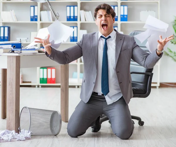 The angry businessman shocked working in the office fired sacked