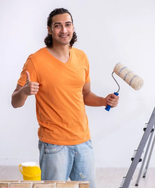 The young man contractor doing renovation at home