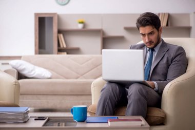 Young employee working from home during pandemic