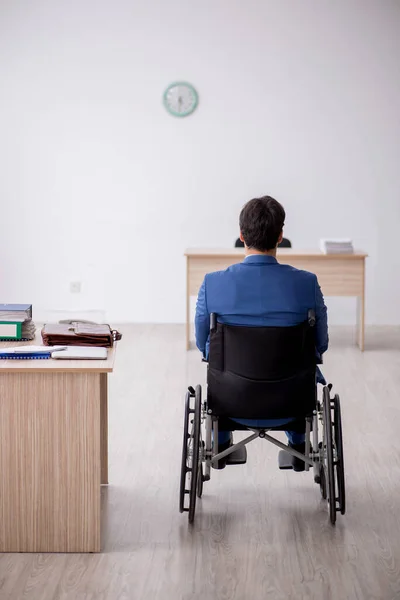 Young businessman employee in wheel-chair