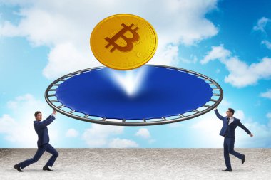 Monetary concept with cryptocurrency bouncing off trampoline