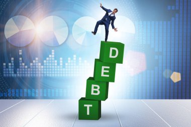 Debt and loan concept with businessman on the cubes