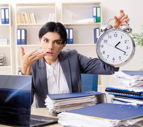 stock image The middle aged businesslady unhappy with excessive work