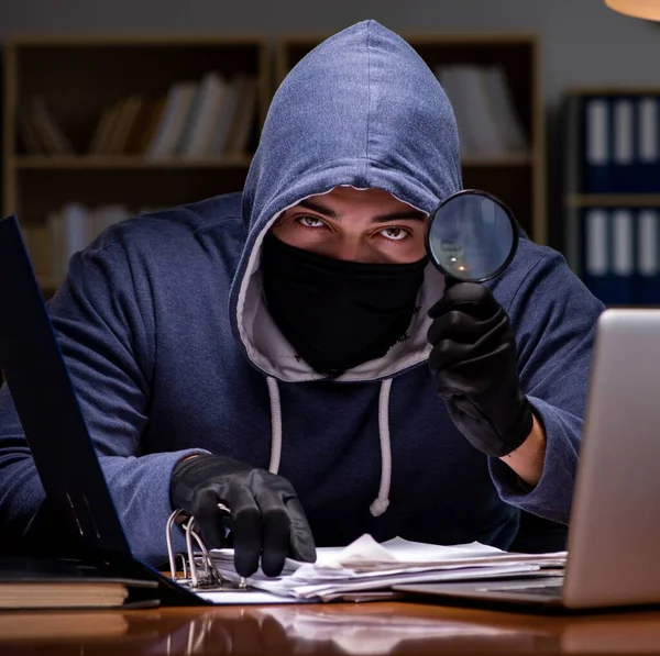 stock image The hacker stealing personal data from home computer