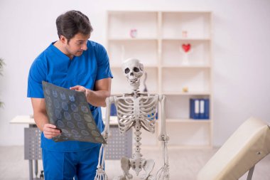 Young doctor and skeleton patient at the hospital