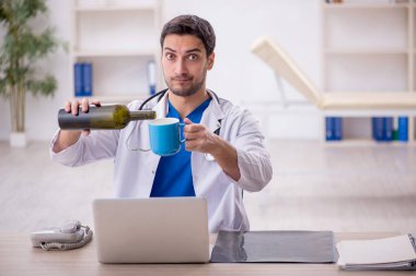 Young doctor in alcoholism concept