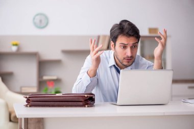 Young employee working from home during pandemic