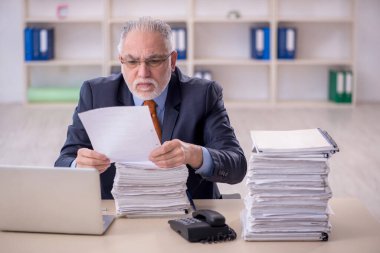 Old male employee and too much work at workplace